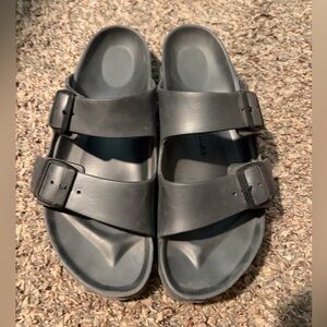 Birkenstock Eva Sandal Two-Strap Slide Sandals in Gray.